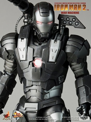 Illustration for article titled How Does War Machine's Gun Work? Can He Sit Down? New Toy Pics Reveal All!